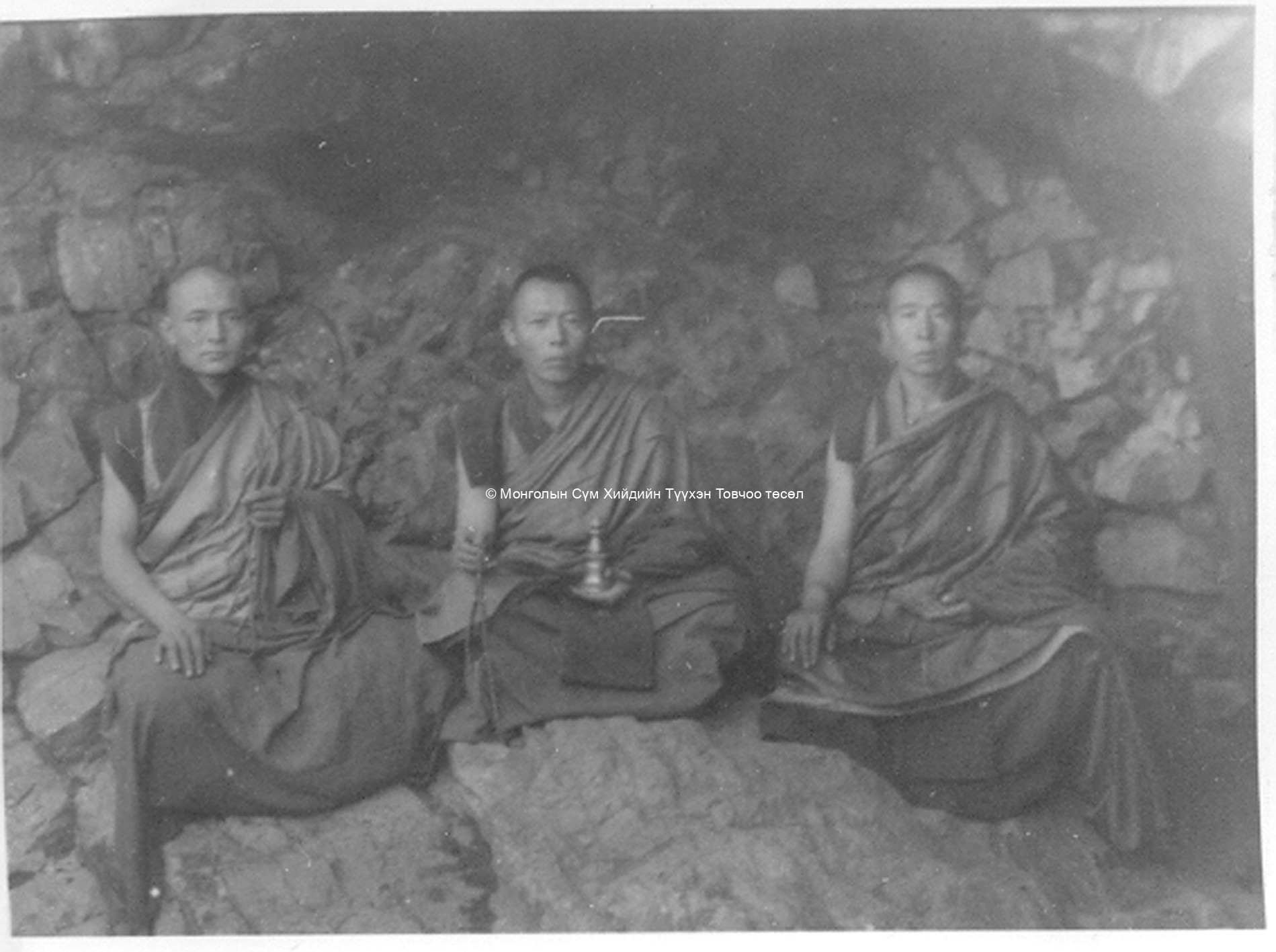 Monks in the meditation cave of Öndör gegeen. Film Archives K-23795